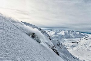 Skier in deep and steep in BC